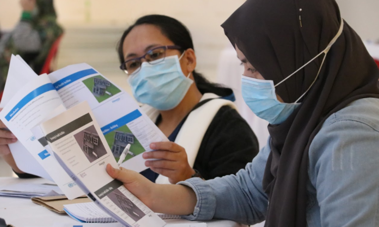 two people looking at a document