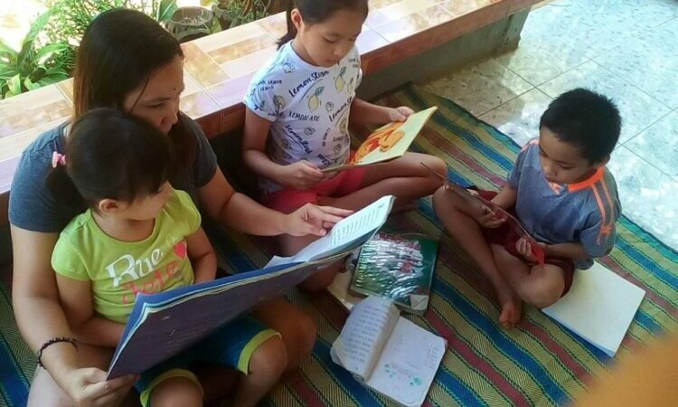 person reading to children