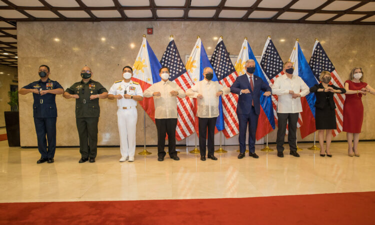 U.S. National Security Advisor (NSA) O’Brien, Secretary of Foreign Affairs Locsin, U.S. Chargé d’Affaires Law and Philippine military officers touch elbows in solidarity.