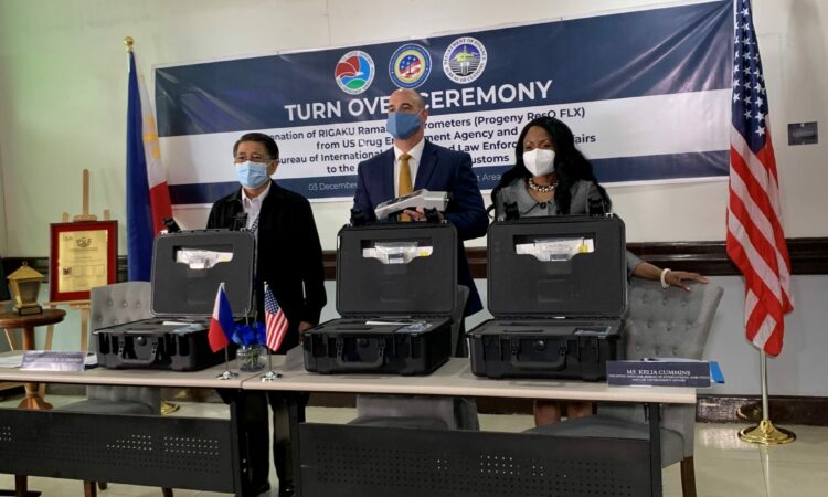 BOC Commissioner Leonardo B. Guerrero (left) showcases the donated equipment along with U.S. Drug Enforcement Administration Country Attaché Christopher Adduci (center) and U.S. Embassy Director for International Narcotics and Law Enforcement Affairs Kelia Cummins (right).