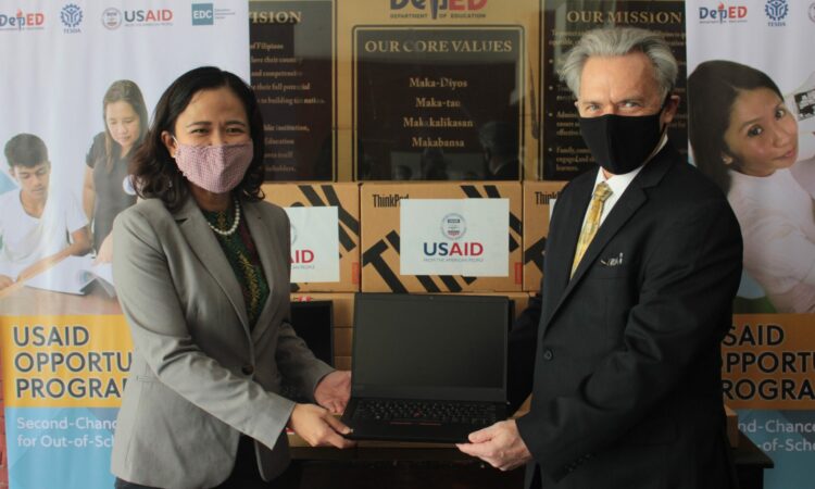 USAID Office of Education Chief Thomas LeBlanc (right) hands over the USAID-donated laptop computers to Department of Education (DepEd) Undersecretary for Alternative Learning System G.H. Ambat during a ceremony at the DepEd Complex in Pasig City on February 19.