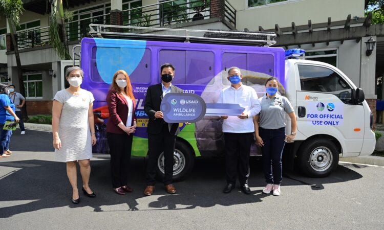USAID ceremonially hands over the key to the wildlife ambulance to the DENR.