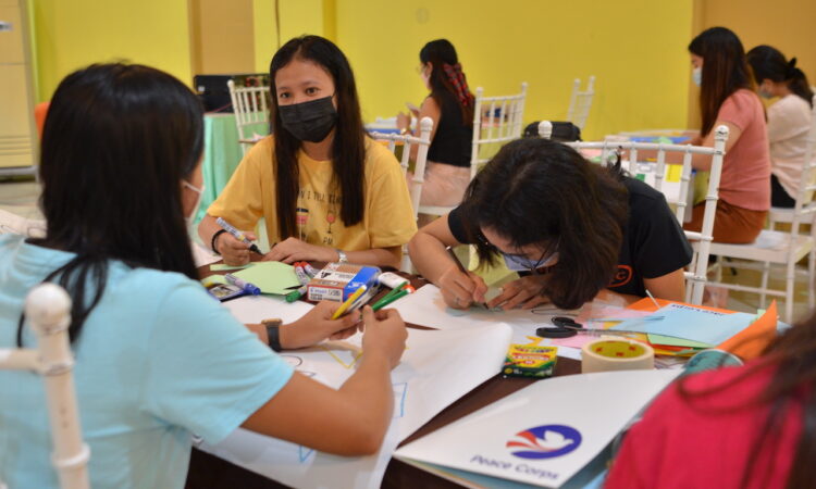 youth sitting at table