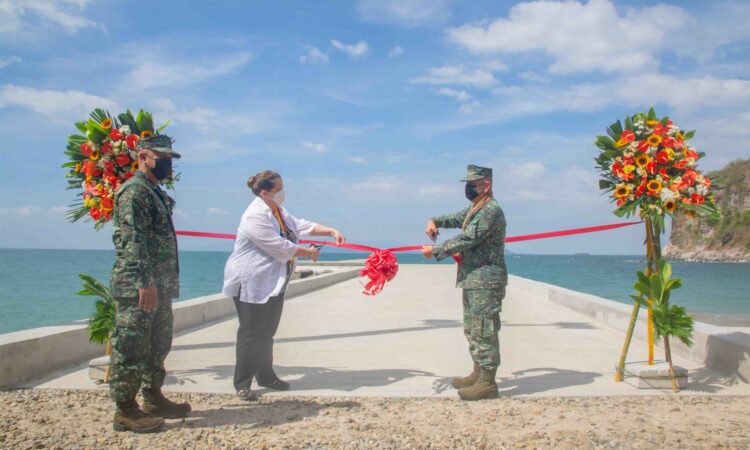 people cutting ribbon