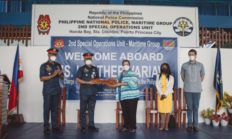 Chargé d’Affaires ad interim Heather Variava with representatives from the Philippine National Police-Maritime Group at the ceremonial turnover of outboard engines