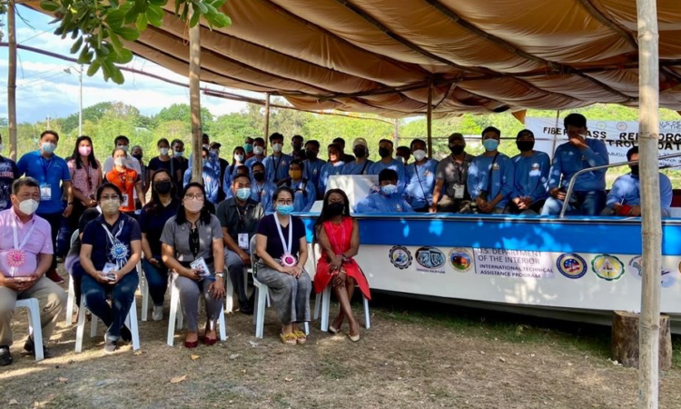 Officials from INL, the provincial governments of Pangasinan and La Union, Tanggol Kalikasan, Don Mariano Marcos Memorial State University, and Pangasinan State University join trainees at the conclusion of their fiberglass-reinforced patrol boat training and the turnover of the boats.