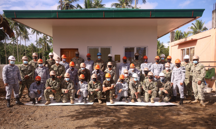 Service members of the U.S. Naval Mobile Construction Battalion 3, 9th Engineer Support Battalion, and Naval Combat Engineering Brigade, Philippine Navy, complete the construction of a health clinic in Barangay Taysan, Legazpi City.