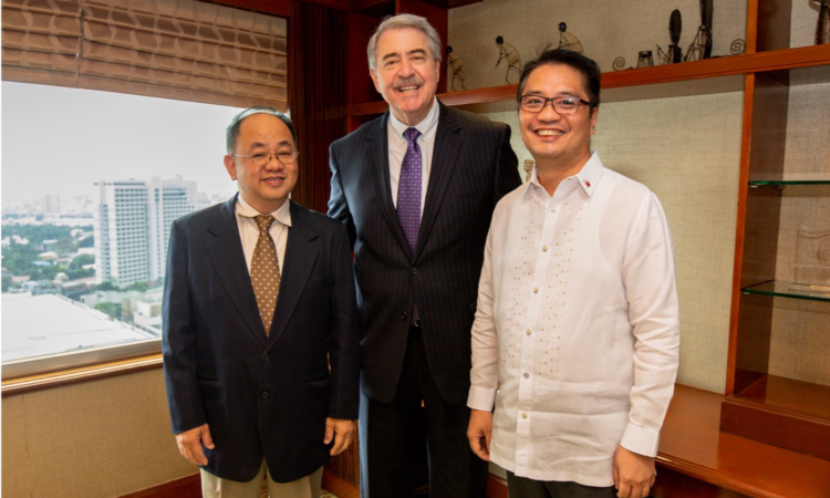 U.S. Under Secretary of Agriculture for Trade and Foreign Agricultural Affairs Ted McKinney (center) joins Philippine Under Secretary of Agriculture Rodolfo Vicerra (left) and Under Secretary of Health Rolando Enrique Domingo (right) in announcing the new Food for Progress Project.