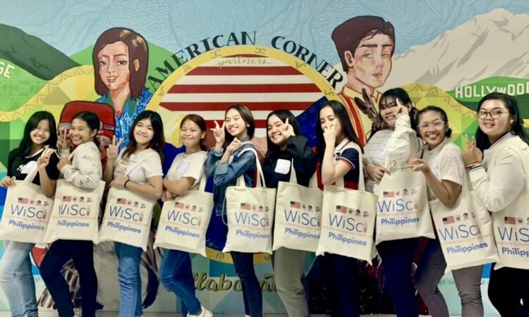Davao campers at the American Corner mural at Ateneo de Davao University