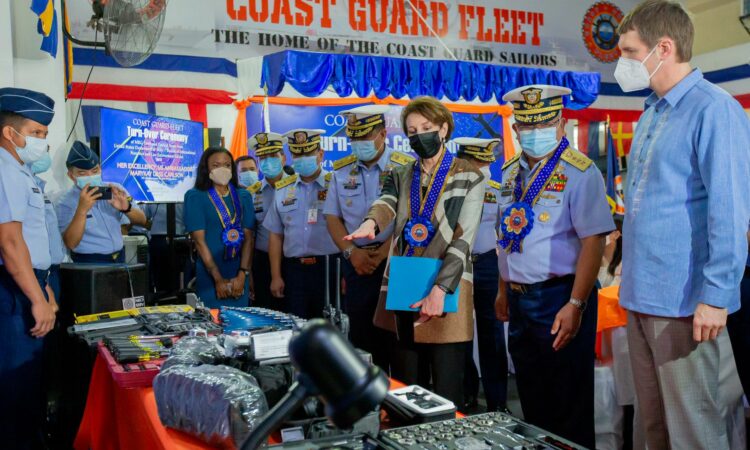 U.S. Ambassador Carlson, PCG Deputy Commandant Vice Admiral Fabricante, and INL Manila Director Kelia Cummins inspect U.S.-donated maritime tactical gear and maintenance equipment for the PCG during the turnover ceremony at the PCG headquarters in Manila on August 22.