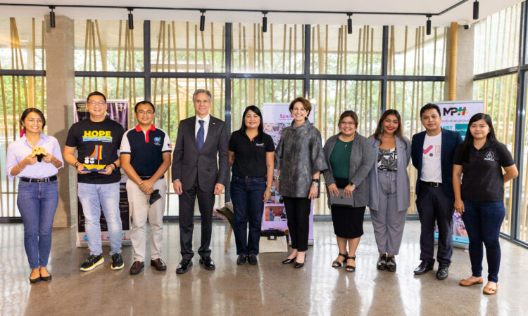 Secretary of State Antony Blinken and U.S. Ambassador to the Philippines MaryKay Carlson with representatives from eight civil society organizations in the Philippines