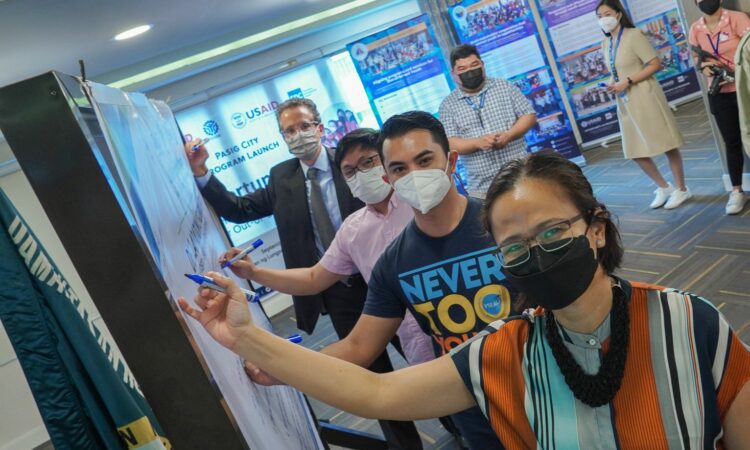 From left: USAID Mission Director Ryan Washburn joins Rechie Tugawin of the Office of the Pasig City Mayor, Pasig City Councilor Quin Kin Cruz, and DepEd Asec. G.H. Ambat at the signing of the commitment wall marking the launch of Opportunity 2.0 for out-of-school youth in Pasig City.