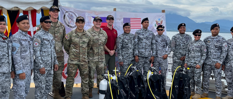 Members of the PCG receive dive equipment donated by the U.S. Embassy Civil Affairs Team during a turnover ceremony aboard the BRP Teresa Magbanua on November 5.
