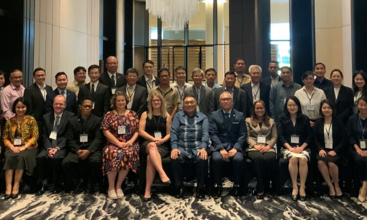 Workshop participants inside a large room.