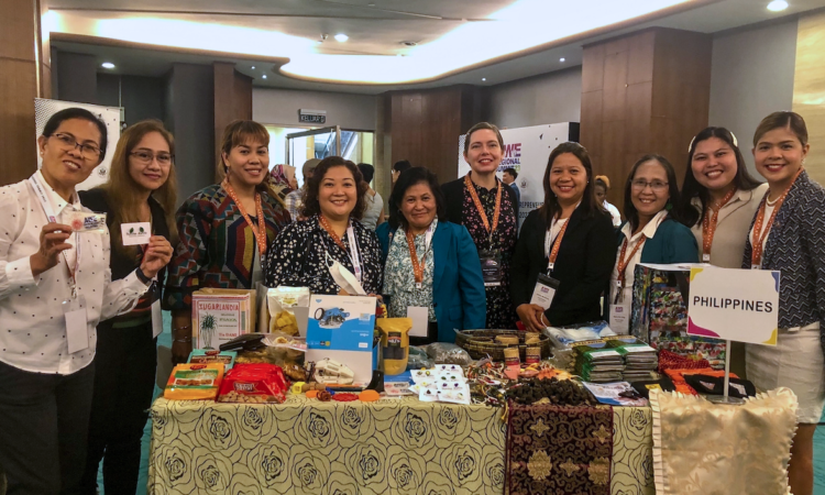 U.S. Embassy Assistant Cultural Affairs Officer Pauline Anderson (fifth from right) with AWE beneficiaries.