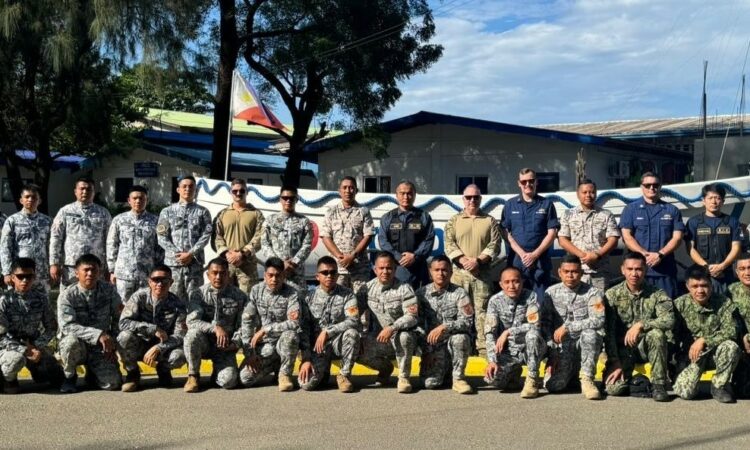 Coast guard instructors from the U.S., Philippines, Japan, and Malaysia pose with trainees from the Philippine Coast Guard (PCG) and the Philippine National Police-Maritime Group (PNP-MG).