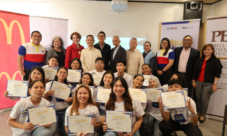 U.S Ambassador MaryKay Carlson (third from left) joins Technical Education and Skills Development Authority Director General Jose Francisco Benitez (fourth from left), McDonald’s Philippines President and CEO Kenneth Yang (fifth from left), and Philippine Business for Education Chair Ramon del Rosario Jr. (fifth from right) in celebrating the first 53 trainees who graduated from McDonald’s Philippines and YouthWorks PH’s joint work-readiness and job-placement program.