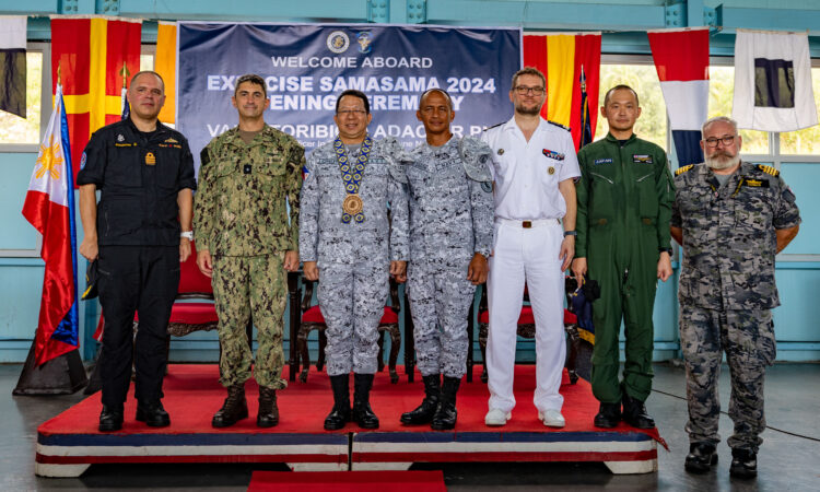 Rear Adm. Todd Cimicata, Commander, Logistics Group Western Pacific/Task Force 73 (COMLOG WESTPAC/CTF 73) (left) poses for a photo with Rear Adm. Jose Ma Ambrosio Q. Ezpeleta, Vice Commander, Philippine Navy, (middle) and Commodore Edward Ike Morada De Sagon, Commander, Naval Forces Northern Luzon (right) at the opening ceremony of Exercise Sama Sama, on Naval Operating Base-Subic, Subic, Zambales, Oct. 7. Sama Sama is a bilateral exercise hosted by the Philippians and the United States, with participants form Australia, Canada, France, and Japan, designed to promote regional security cooperation, maintain and strengthen maritime partnerships, and enhance maritime interoperability. (U.S. Navy photo by Mass Communication Specialist 1st Class Hannah Fry)