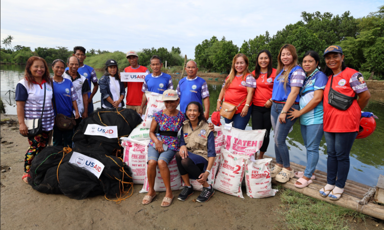 USAID Philippines Deputy Mission Director Rebekah Eubanks joins members of Ilocos Norte’s fisherfolk community as they receive U.S. government-donated fishing equipment and supplies to increase their income and strengthen food security in the province.