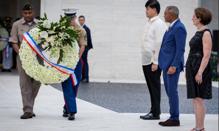 Left: (From right) U.S. Ambassador MaryKay Carlson, American Battle Monuments Commission Chairman Michael Garrett, and Philippine Department of National Defense Senior Undersecretary Irineo Espino look on as U.S. service members lay a wreath during the Veterans Day ceremony at the Manila American Cemetery in Taguig City.