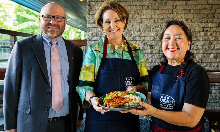 (From left) U.S. Embassy Agricultural Counselor Michael Ward, U.S. Ambassador MaryKay Carlson, and Chef Nancy Reyes-Lumen hold a plate of U.S. Chicken BBQ-Adobo with Adobo Glaze.
