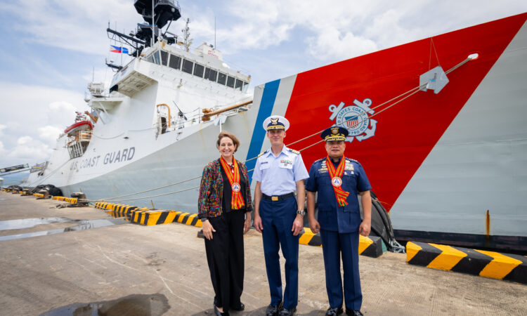 (From left) U.S. Ambassador MaryKay Carlson, U.S. Coast Guard (USCG) Cutter Stratton Commanding Officer Captain Brian Krautler, and Philippine Coast Guard (PCG) Commandant Admiral Ronnie Gil Gavan stand before the USCGC Stratton at the Puerto Princesa Port in Palawan on May 16.