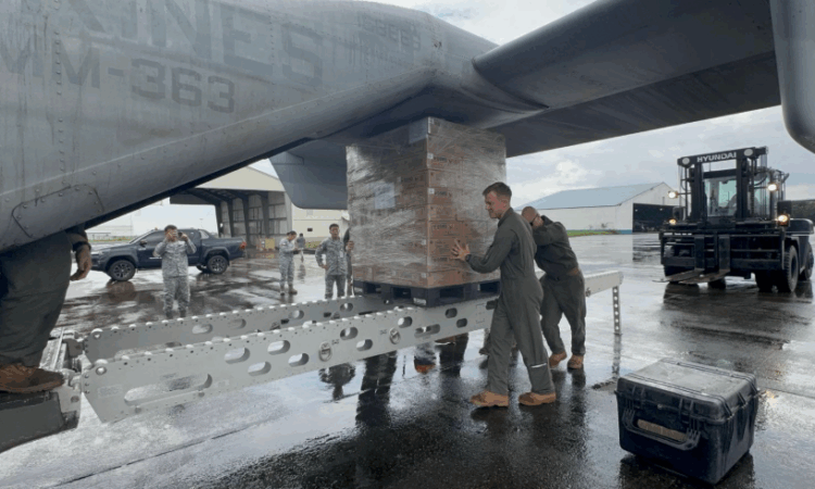 U.S. Marines and Philippine Airmen prepare the delivery of Department of Social Welfare and Development (DSWD) family food packs at Clark Air Base. (Photo credit: Philippine Air Force)