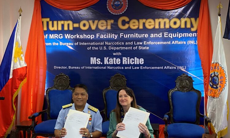 Rear Admiral Rommel Supangan and INL Director Kate Riche sign a donation agreement for U.S.-donated equipment to the PCG Fleet Maintenance Workshop in Cavite.