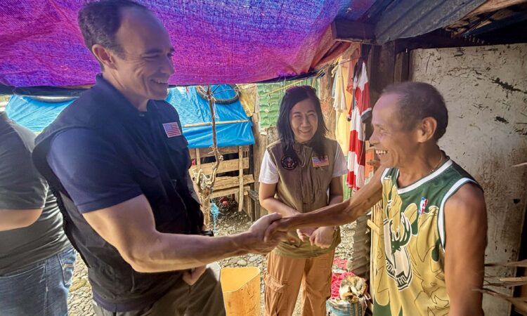 Mang Delfin welcomes the U.S. Embassy team and shares his gratitude for the disaster assistance provided by the U.S. Government, which would help him repair his home.
