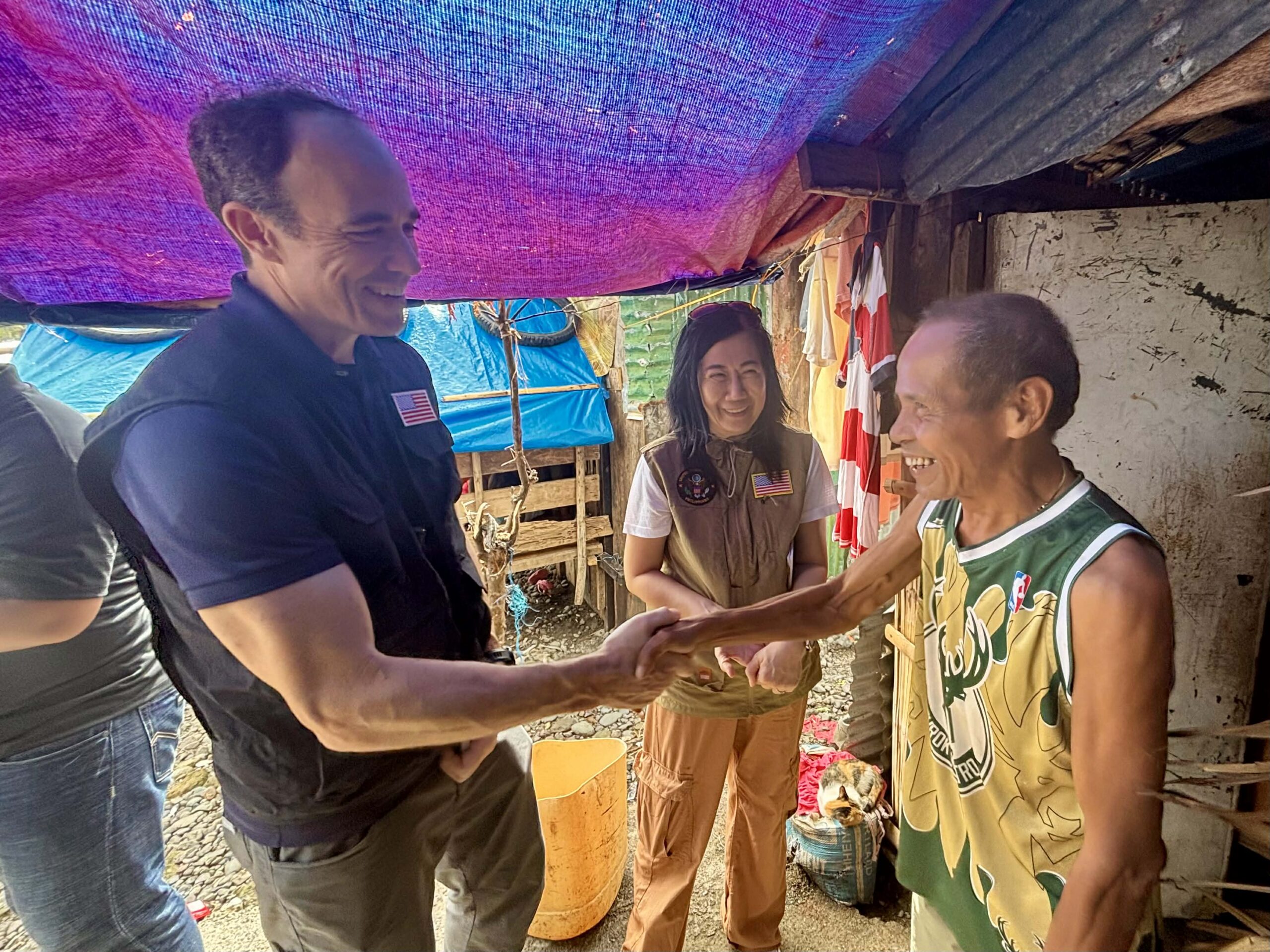 Mang Delfin welcomes the U.S. Embassy team and shares his gratitude for the disaster assistance provided by the U.S. Government, which would help him repair his home.
